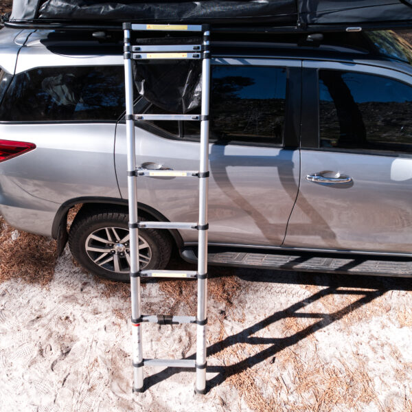 Lightweight telescopic ladder for easy access to a cartop rooftop tent